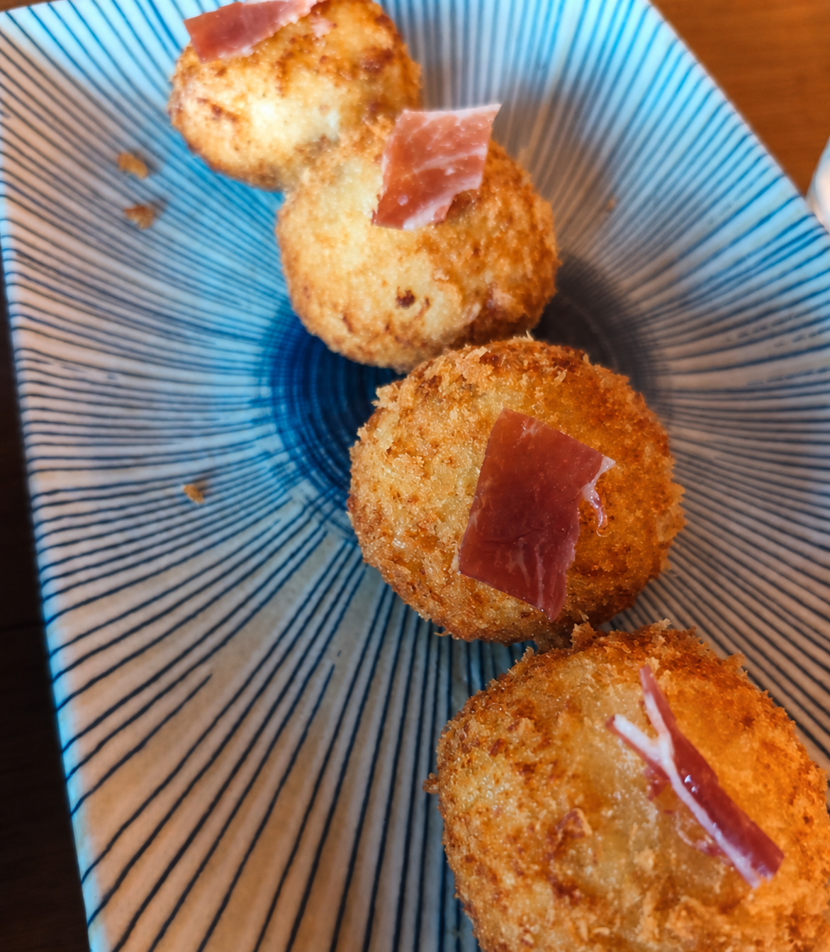 Crisp croquettes topped with cured ham at La Favorita in Ibiza Town