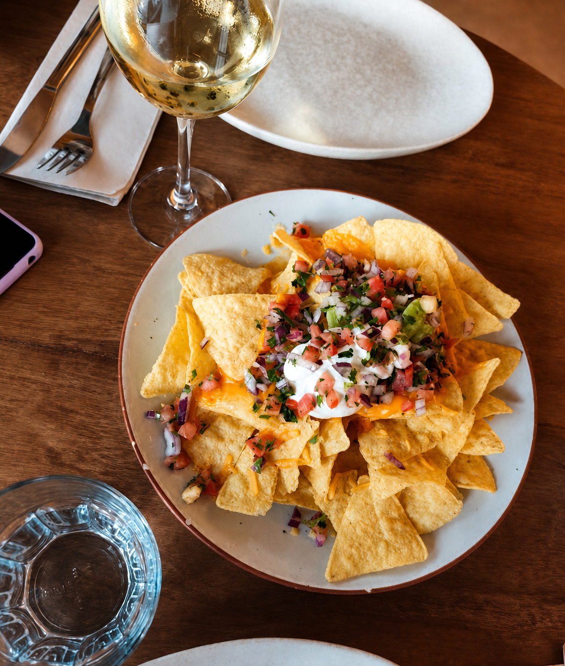 Nachos with melted cheese, pico de gallo and sour cream at La Favorita Ibiza