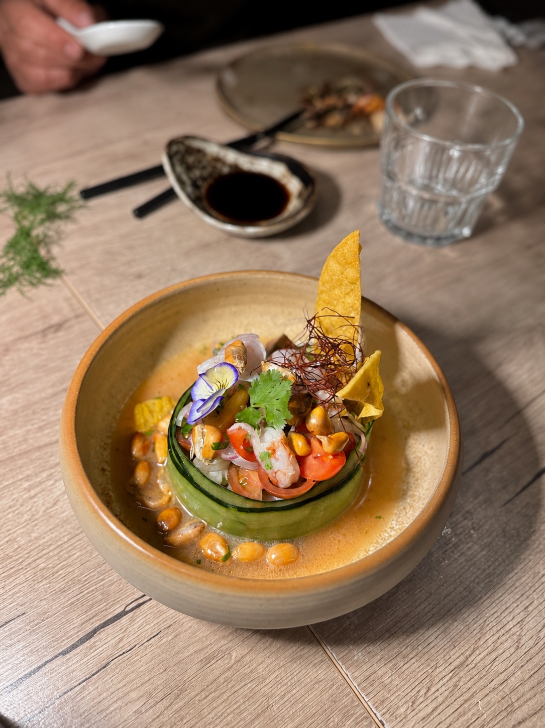Ceviche Nagai served with cucumber, corn, herbs and a crisp garnish at NAGAI Ibiza.