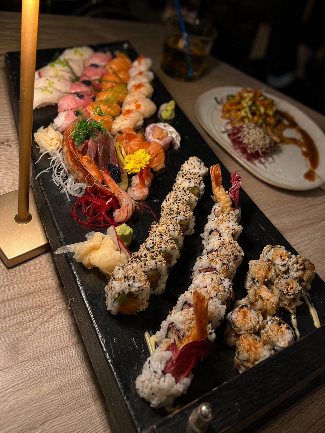 Sushi and sashimi platter with nigiri, prawns and rolls at NAGAI Ibiza Japanese restaurant.