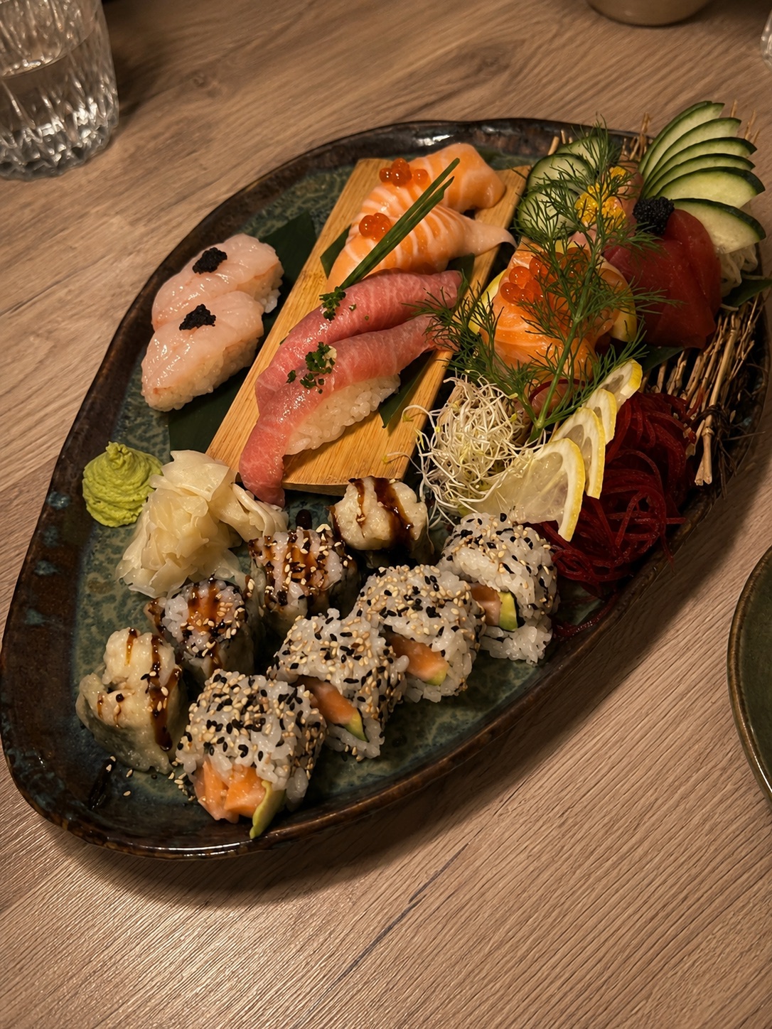 Sushi selection with nigiri, rolls, cucumber, ginger and wasabi at NAGAI Ibiza.
