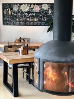 Dining room with fireplace at Wild Beets in Santa Gertrudis, Ibiza.